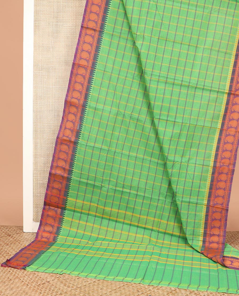 Green medium-sized checked Chettinad cotton saree, contrast temple border of paisleys, and striped pallu