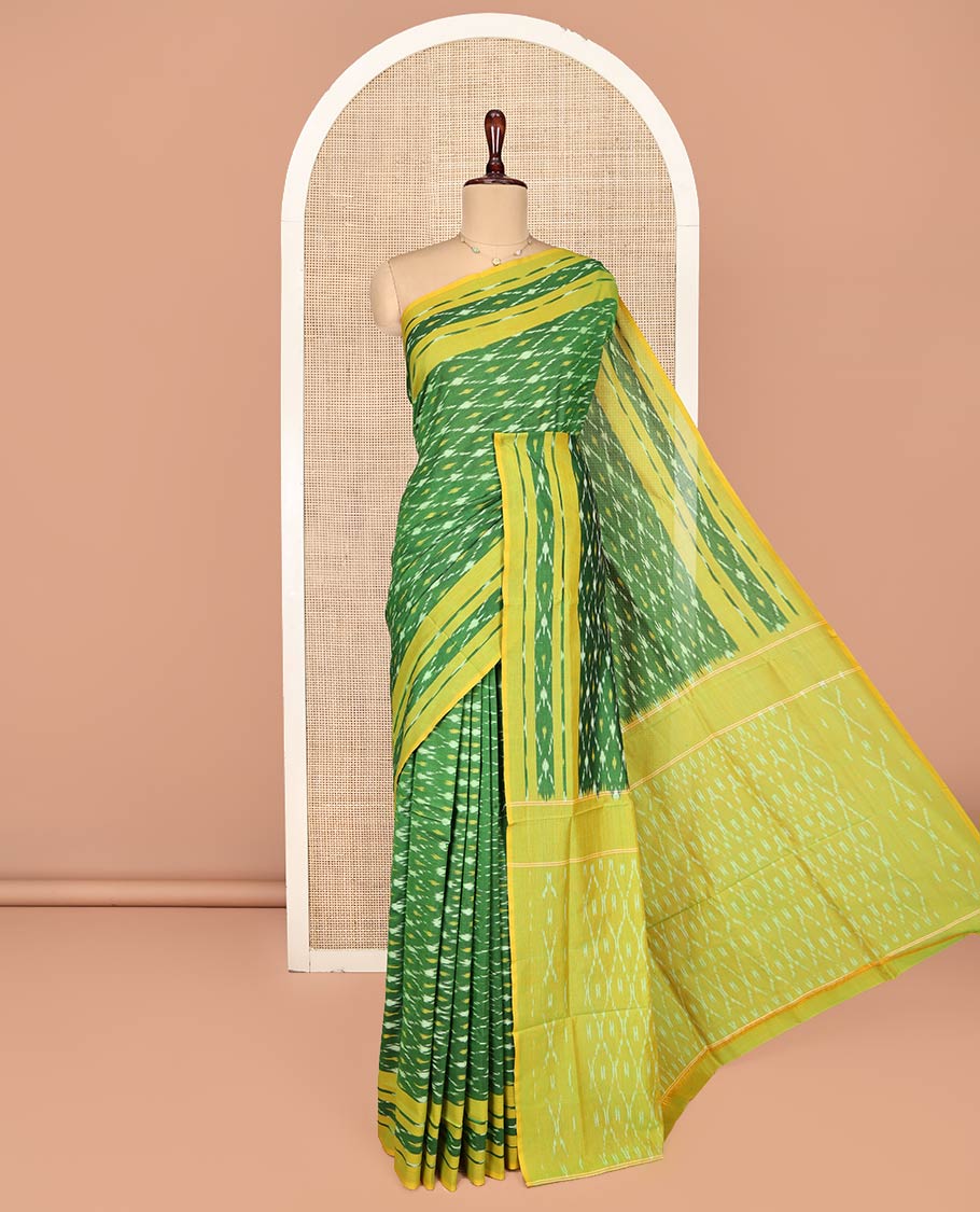 Green Ikkat Cotton Saree, Ornamented with Ikkat-Style Jaal-Patterns on Its Body, Complemented by Contrast Ikkat Border, Pallu of Jaal Designs, and Has No Blouse