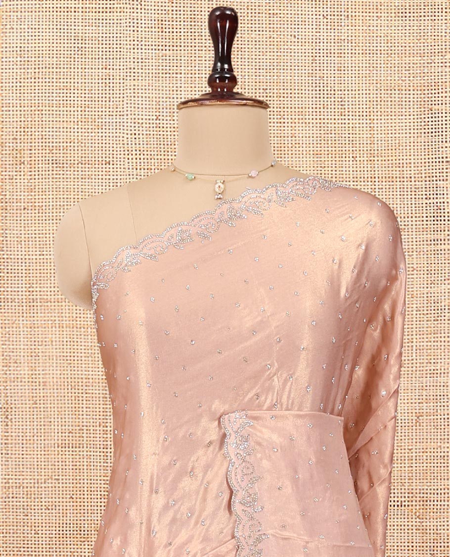 Rose Gold Designer Saree, Gleamed up with Stone Struck All Over Its Body, Scallop Stone Embroidered Border, and Heavy Embroidered Matching Blouse