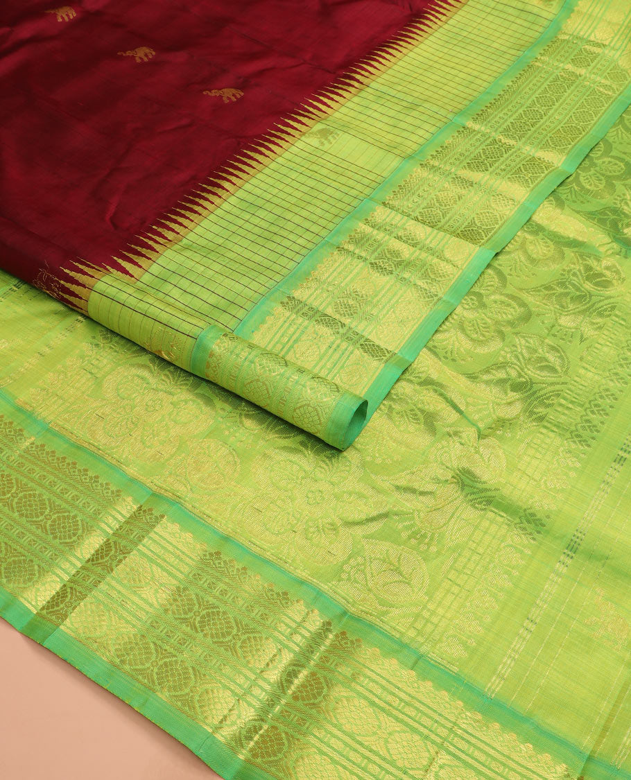 Maroon yaanai buttas Kanchipuram silk saree, contrast thazampoo rekku checked border of salngai, banaras, lavangam, and laddu kamalam designs, and floral design pallu