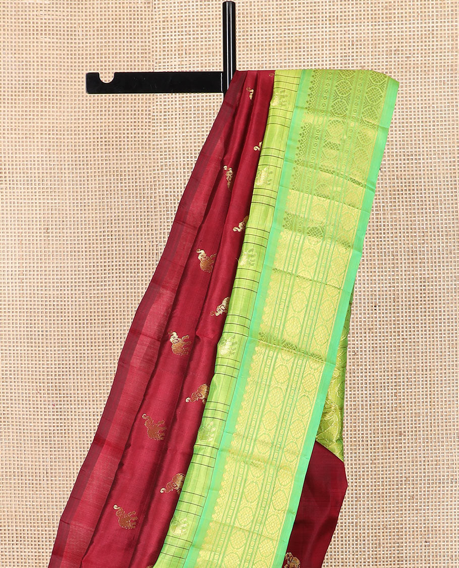 Maroon yaanai buttas Kanchipuram silk saree, contrast thazampoo rekku checked border of salngai, banaras, lavangam, and laddu kamalam designs, and floral design pallu