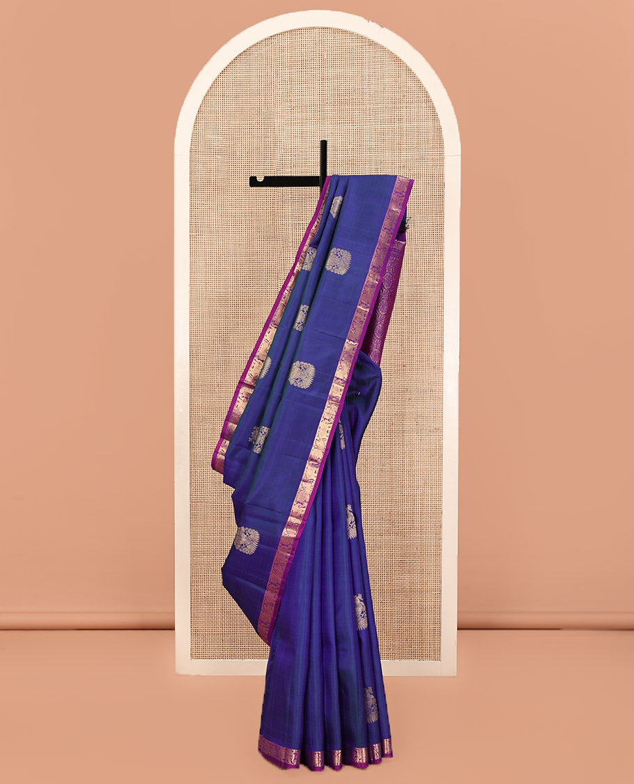 Blue Kanchipuram Silk Saree, Enthralled with Iruthalai Pakshi Buttas All Over Its Body, Complemented by Contrast Border of Rekku, Mayil, and Yaanai Designs, Pallu of Floral Jaal Designs, and Paired with a Contrast Blouse
