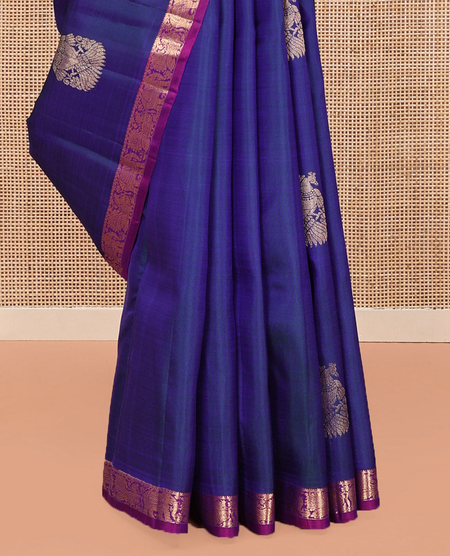 Blue Kanchipuram Silk Saree, Enthralled with Iruthalai Pakshi Buttas All Over Its Body, Complemented by Contrast Border of Rekku, Mayil, and Yaanai Designs, Pallu of Floral Jaal Designs, and Paired with a Contrast Blouse