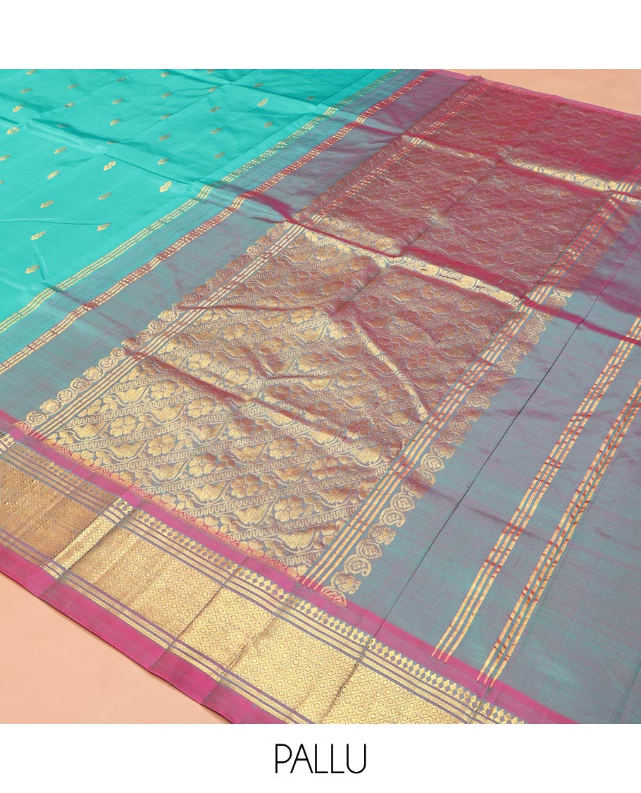 Blue Kanchipuram Silk Saree, Bedecked with Zari Buttas on Its Body, Complemented by a Contrast One-Sided Border of Panner Sombu, Banaras, and Jaal Designs, Pallu Features Floral Creeper Designs, and Comes Without a Blouse