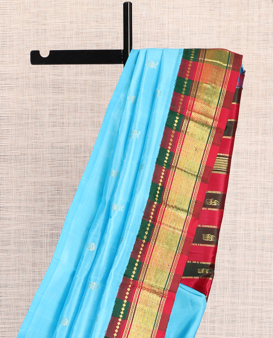 Blue Kanchipuram Silk Saree, Subtly Woven with Zari Buttas, a Contrast Korvai One-Sided Border of Rekku, Banaras, Muthu, and Jaal Design, Zari Design Pallu, and No Blouse
