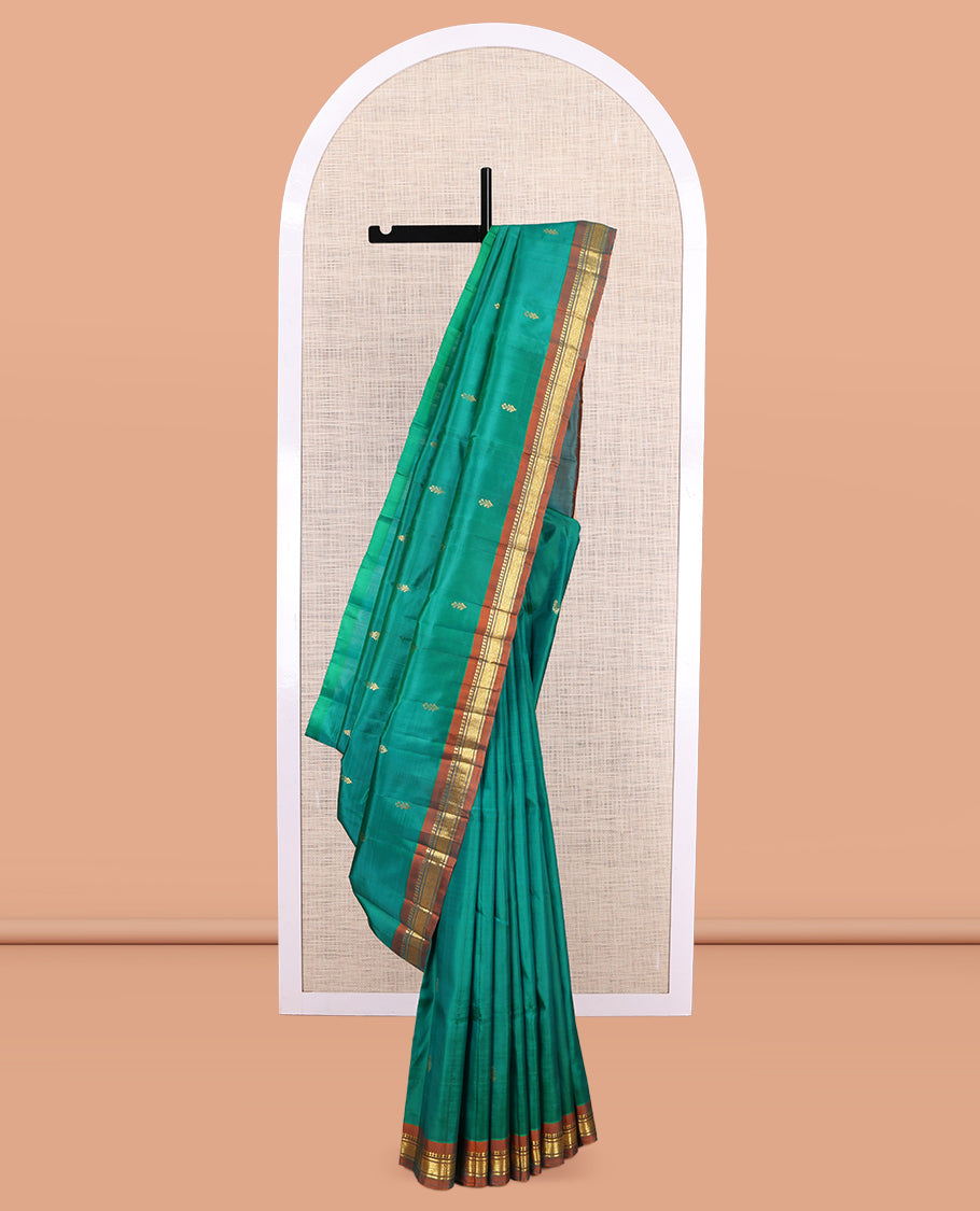 Green Kanchipuram Silk Saree, Woven with Zari Buttas, a Contrast One-Sided Border of Panner Sombu, Banaras, and Jaal Designs, Zari Design Pallu, and No Blouse