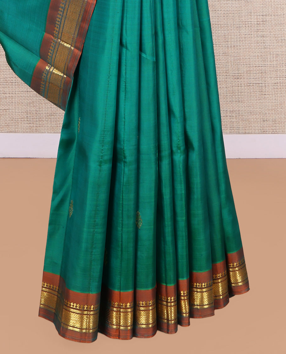 Green Kanchipuram Silk Saree, Woven with Zari Buttas, a Contrast One-Sided Border of Panner Sombu, Banaras, and Jaal Designs, Zari Design Pallu, and No Blouse