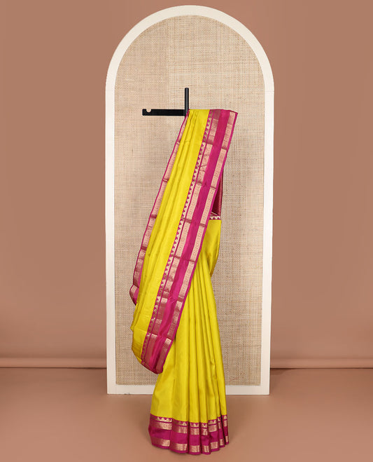 Yellow plain Kanchipuram silk saree, contrast rettai pettu border of thazampoo rekku, neli, chakram & kuthirai & jaal pallu