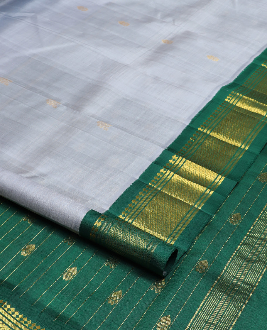 Grey zari buttas Kanchipuram silk saree, contrast one-sided korvai border of paneer sombu, banaras, and jaal design, and zari design pallu