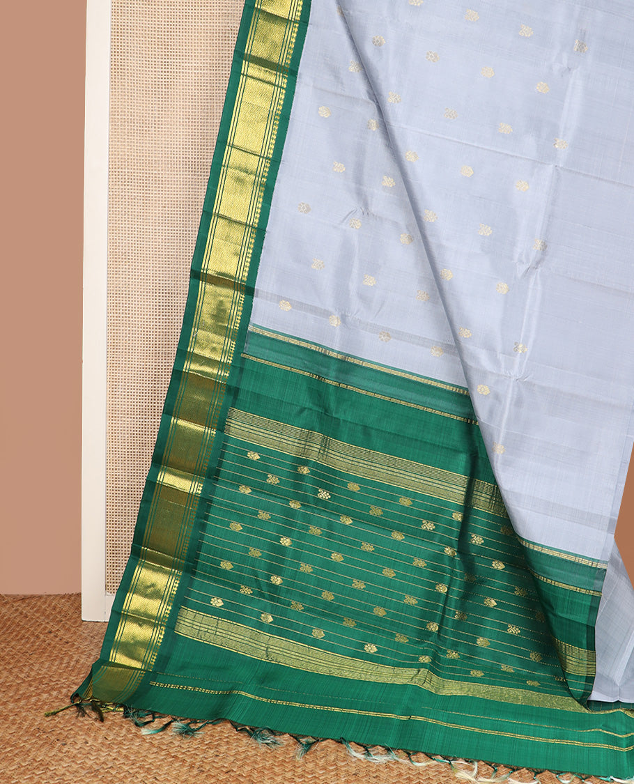 Grey zari buttas Kanchipuram silk saree, contrast one-sided korvai border of paneer sombu, banaras, and jaal design, and zari design pallu