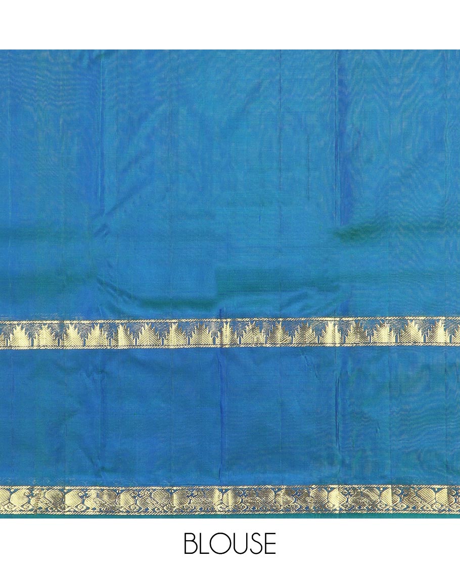 Blue plain Kanchipuram silk saree, contrast rettai pettu border of thazampoo rekku, manga, and mayil designs, and zari striped pallu