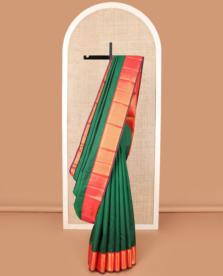 Green plain Kanchipuram silk saree, contrast border of thilakam mokku, muthu, banaras, and ara maadam designs, and ara maadam design pallu