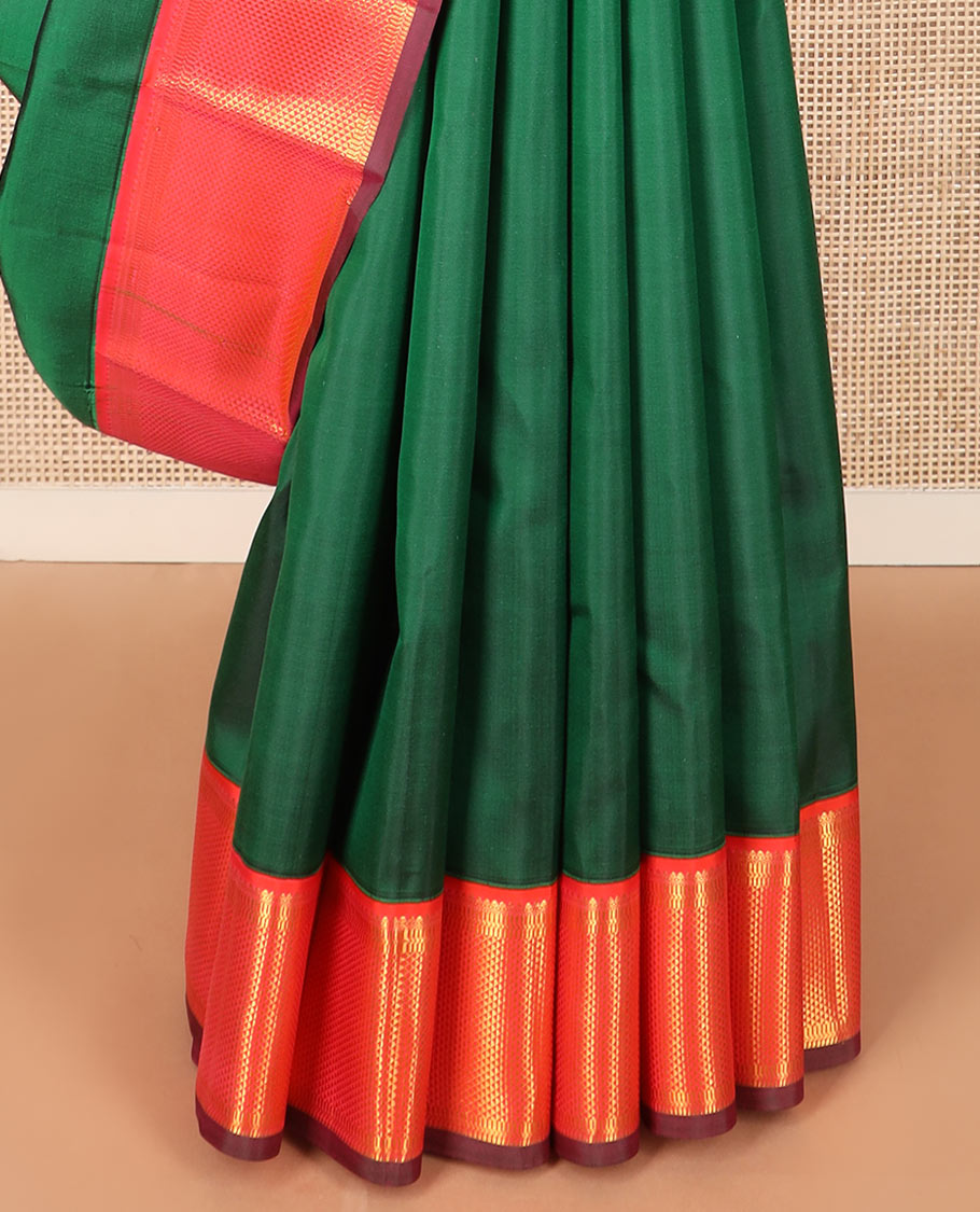 Green plain Kanchipuram silk saree, contrast border of thilakam mokku, muthu, banaras, and ara maadam designs, and ara maadam design pallu