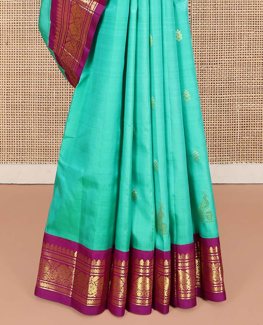 Blue Kanchipuram Silk Saree, Subtly Sparkled with Zari Buttas on Its Body, Complemented by a Contrast One-Sided Korvai Border of Rettai Neli, Banaras, and Floral Designs, Pallu of Paisley-Floral Designs, and Comes Without a Blouse