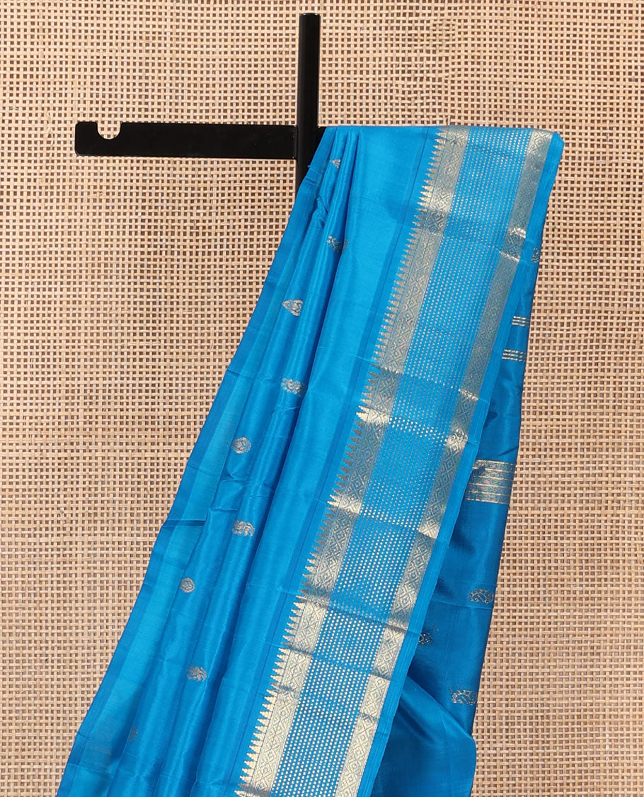 Blue zari buttas Kanchipuram silk saree, one-sided zari border of rekku, banaras, diamond, and muthu designs , and zari design pallu