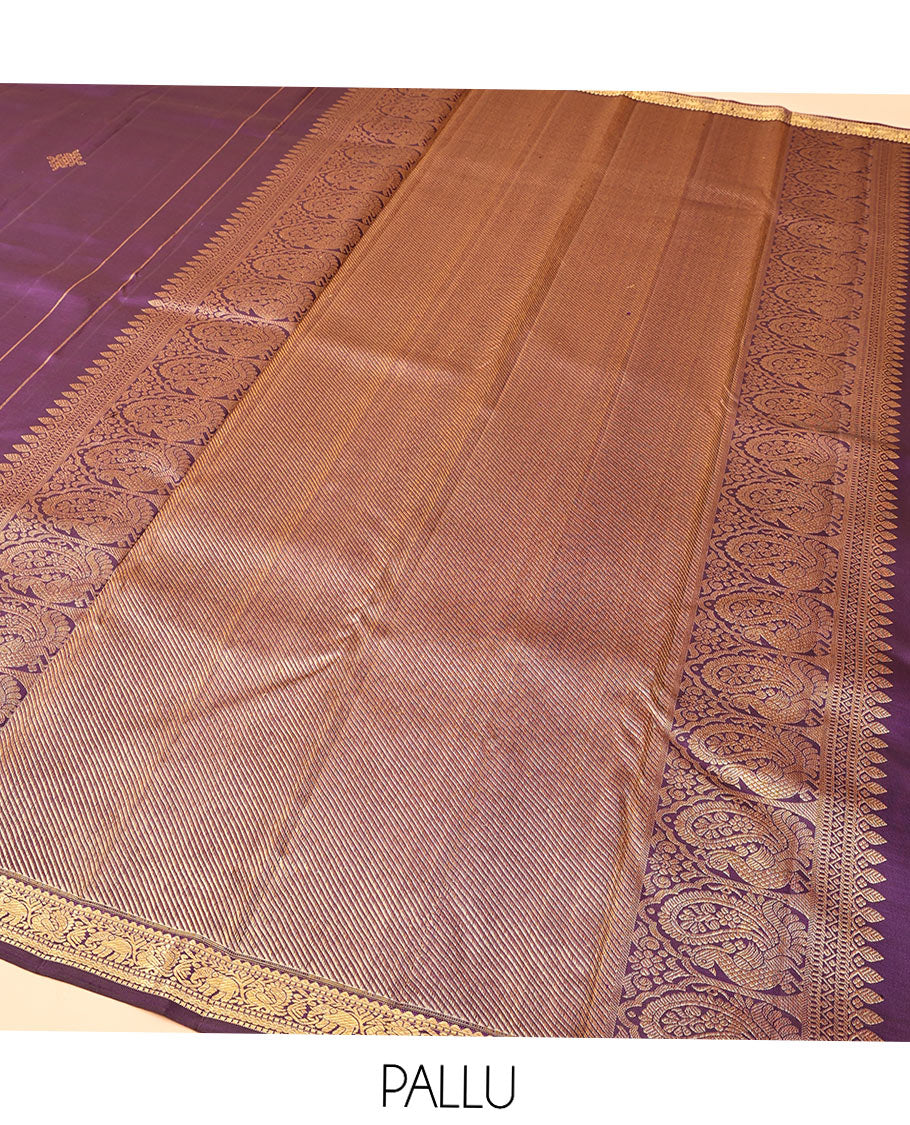 Purple Kanchipuram Silk Saree, Enriched with Kolam Buttas All Over Its Body, Highlighted by Zari Border of Rekku, Muthu, Mayil, Yaanai, and Rettai Neli Designs, Pallu Gleamed with Diagonal Stripes and Mayil Designs, and Paired with a Matching Blouse