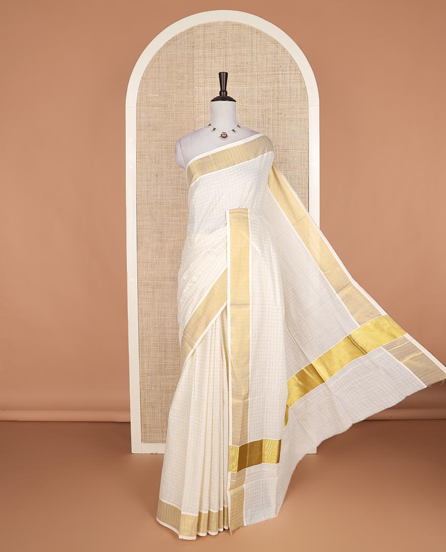 Cream zari checked Kerala cotton saree, zari border, and zari checked design pallu