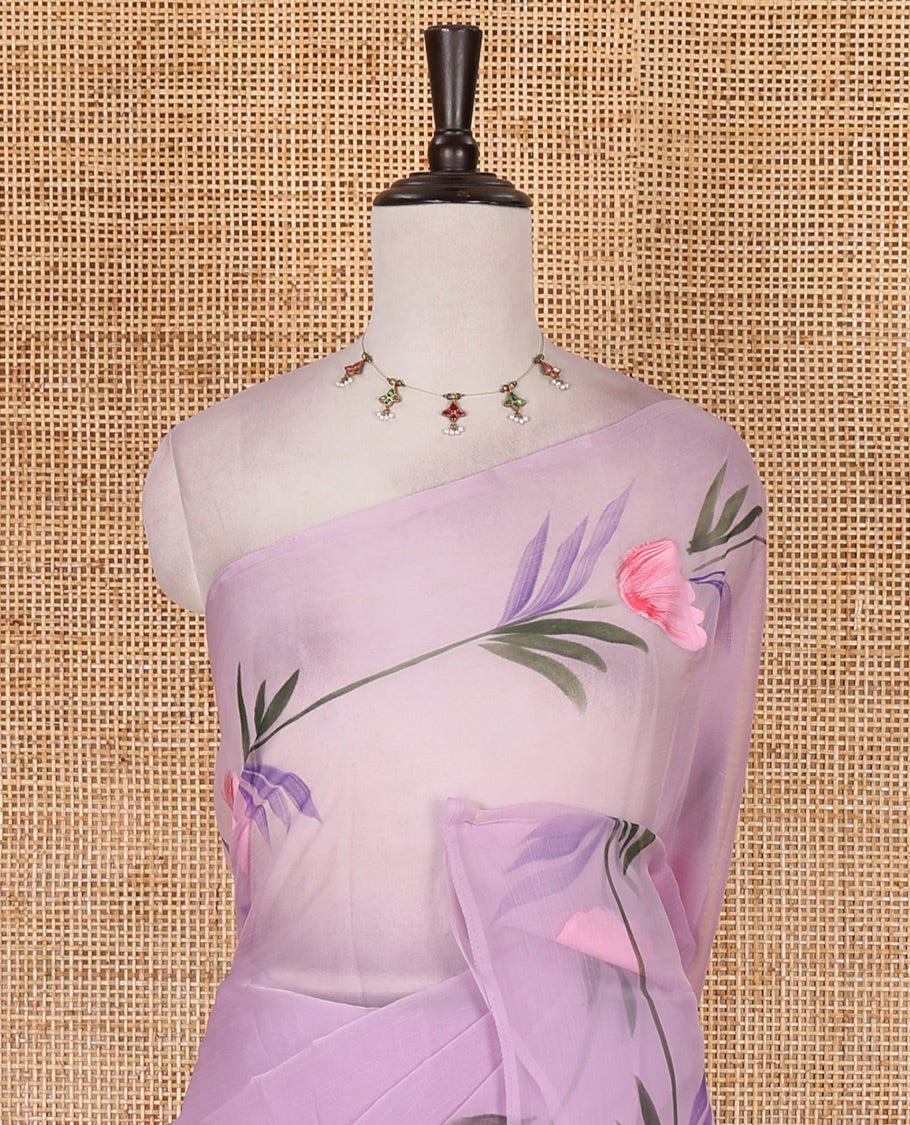Borderless lavender floral motifs hand brush painted semi-organza saree comes with tasseled pallu and without blouse