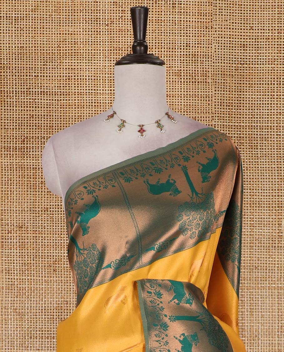 Yellow Pichwai cow zari motifs, Kanchi tissue saree, contrast Pichwai cow motifs copper zari woven border, zari-rich pallu, and contrast zari design blouse