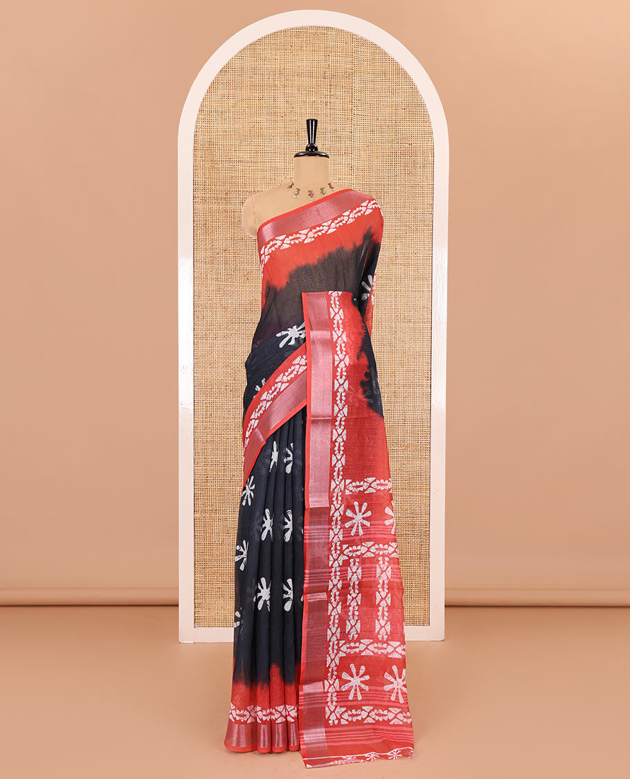 Black flower motifs batik printed linen cotton saree, contrast printed with zari woven border, batik printed pallu, and a contrast printed blouse