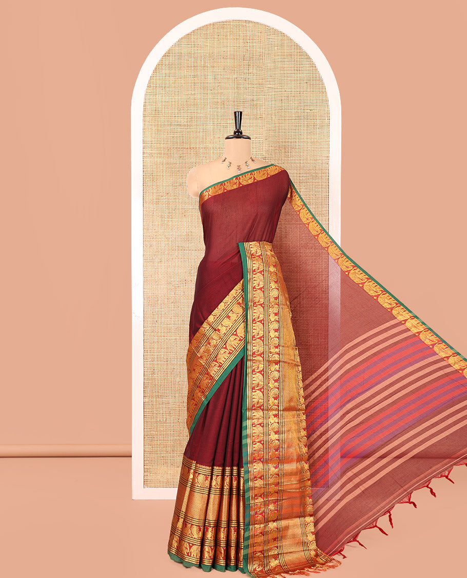 Maroon Plain Mercerised Cotton Saree, Complemented by a Contrast Traditional Border of Peacock, Elephant, and Peacock Eye Designs, Striped Pallu, and Paired with a Matching Blouse