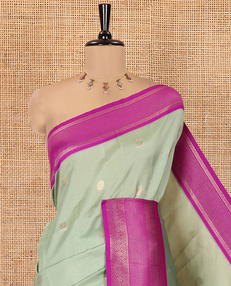 Pista Green Kanchi Silk Saree Features Mayil-Chakram Buttas, a Contrast Traditional Border, Jaal Pallu, and a Contrast Blouse
