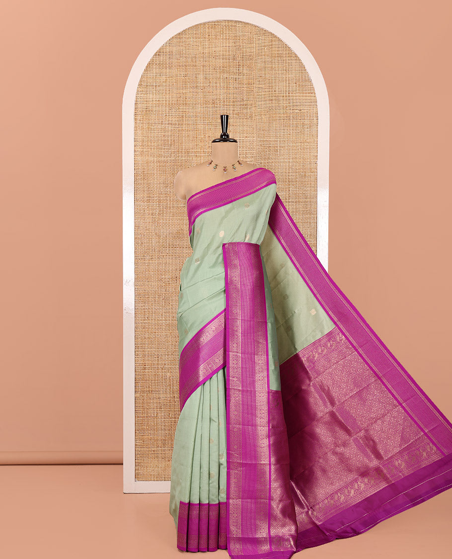 Pista Green Kanchi Silk Saree Features Mayil-Chakram Buttas, a Contrast Traditional Border, Jaal Pallu, and a Contrast Blouse