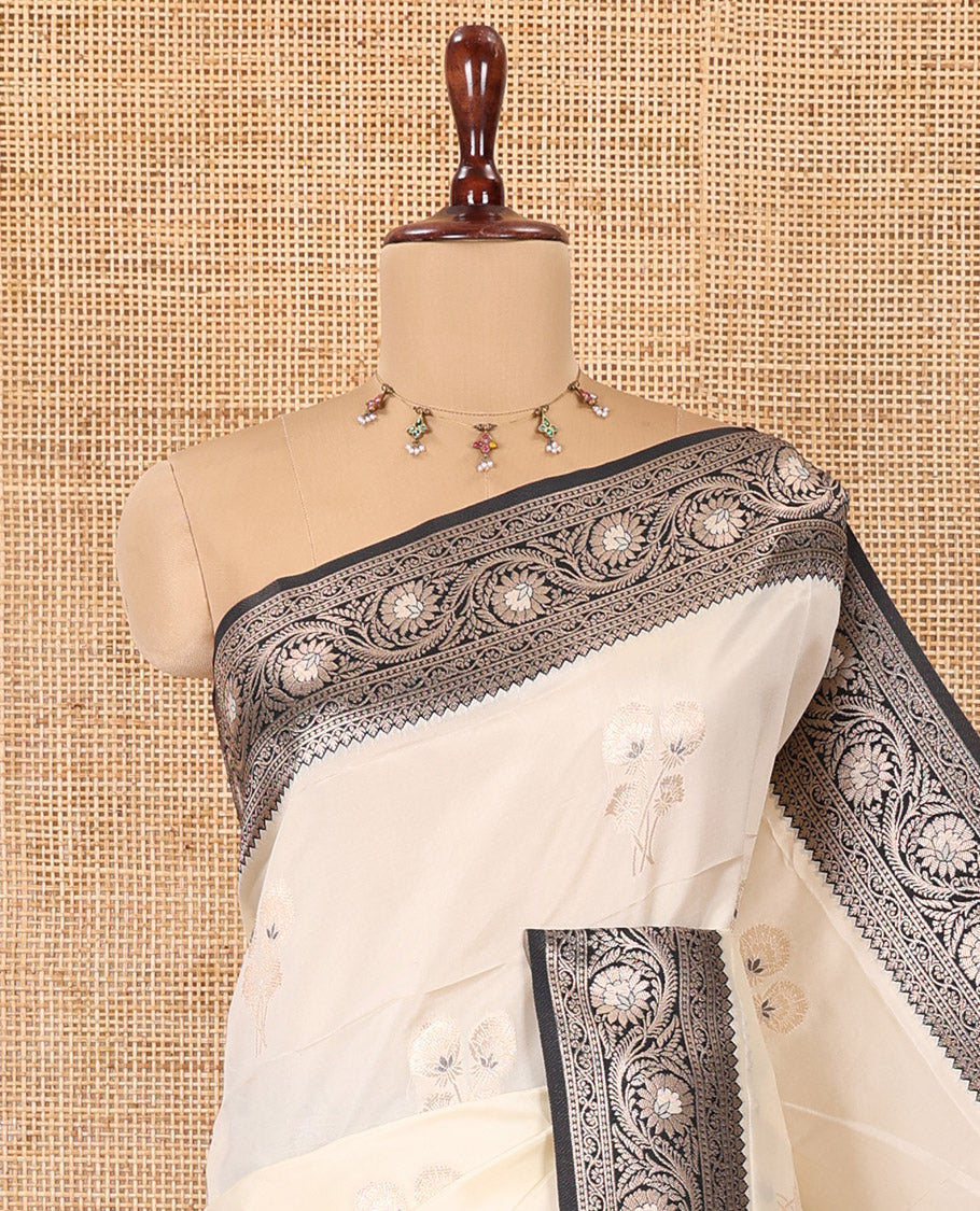 Cream-Black Elite Soft Silk Saree, Accentuated with Zari Buttas, a Contrast Floral Creeper Border, Intricate Pallu, and a Contrast Blouse