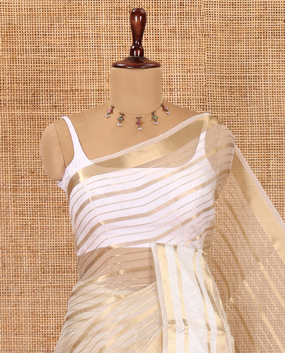 Cream Semi-Organza Saree, Uniquely Detailed with Zari Stripes, Highlighted by a Zari Traditional Border, and a Matching Blouse