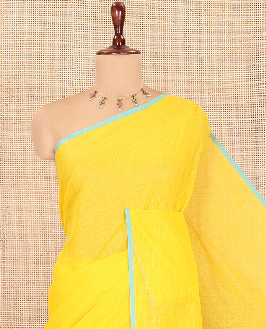 Yellow Geometric Textured Handloom Mercerized Cotton Saree, a Subtle Piping Border, Striped Pallu, and a Contrast Blouse