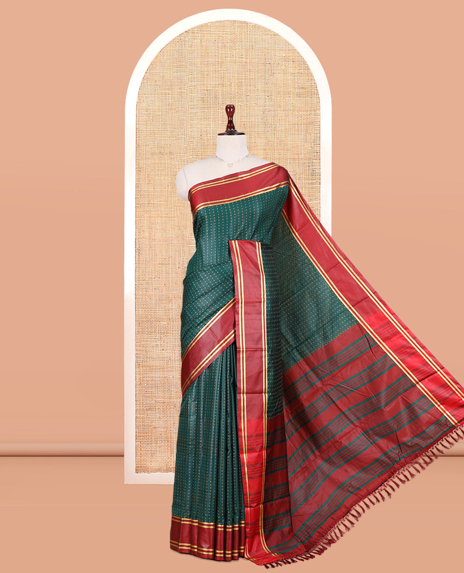 Bottle Green Semi-Soft Silk Saree Steeped with Plus-Shaped Buttas, Contrast Border, and a Matching Blouse