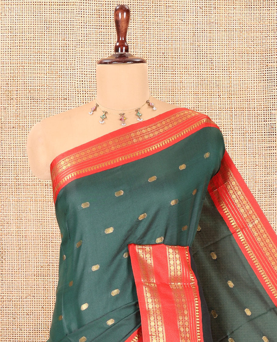 Bottle Green Softy Silk Saree, Adorned with Zari Buttas, a Contrast Traditional Zari Border, and a Matching Blouse