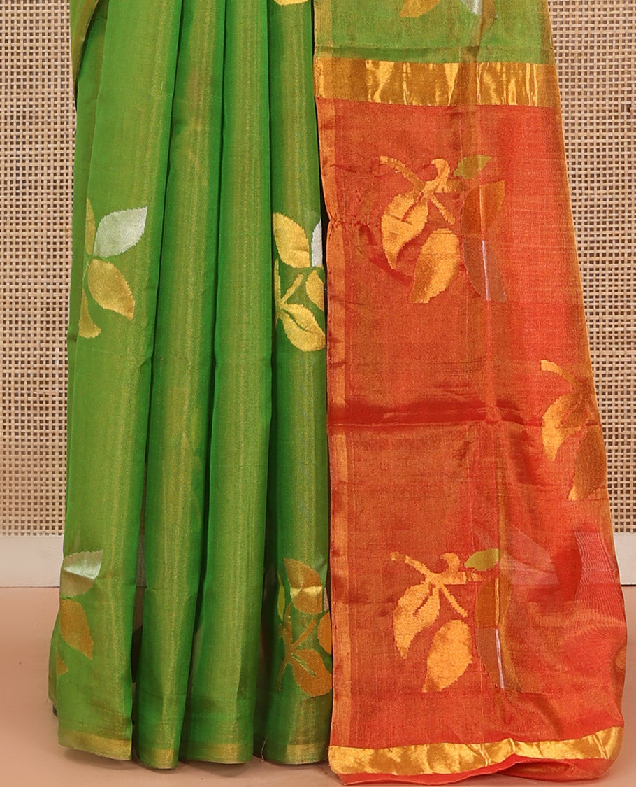Borderless parrot green Uppada Silk Saree Artfully Detailed with Leaf Zari Buttas, Complemented by Contrast Pallu Steeped with Leaf Zari Designs, and Paired with a Contrast Blouse