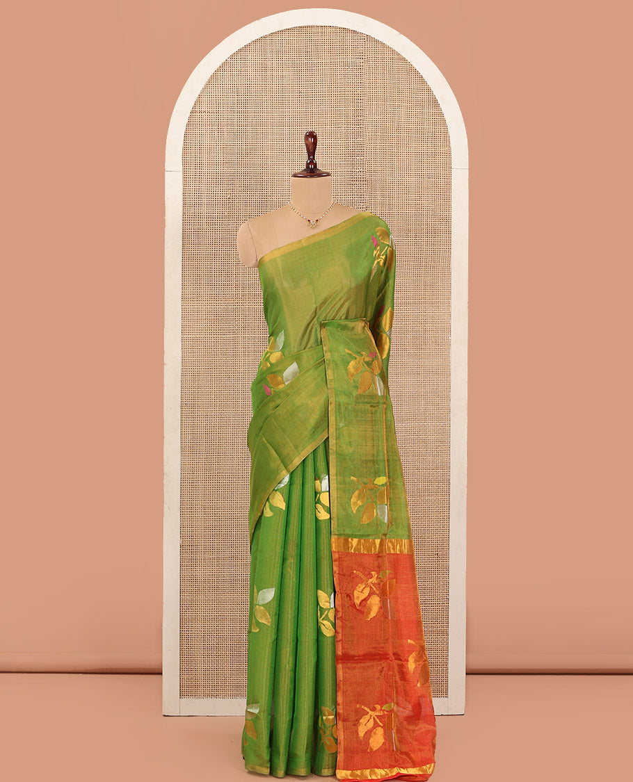 Borderless parrot green Uppada Silk Saree Artfully Detailed with Leaf Zari Buttas, Complemented by Contrast Pallu Steeped with Leaf Zari Designs, and Paired with a Contrast Blouse