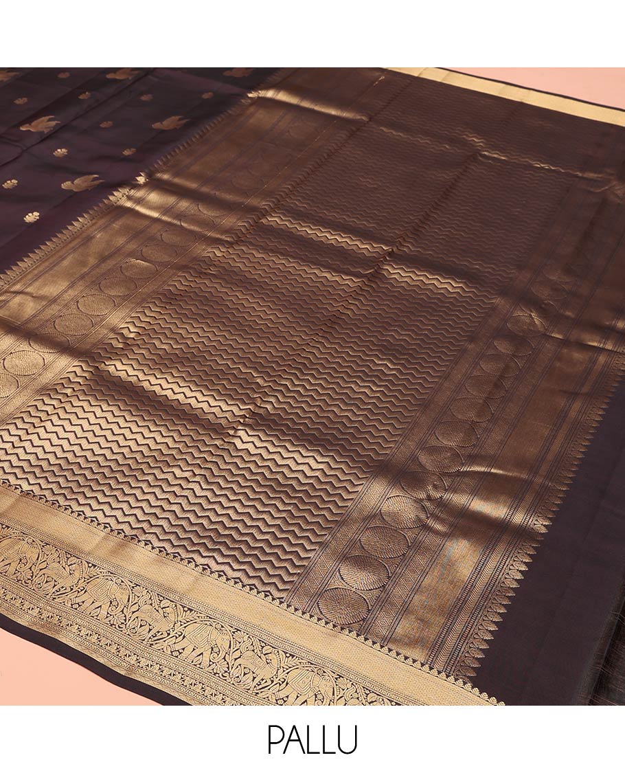 Brown Vasundhara Lite-Silk Mix Saree, Delicately Woven with Zari Buttas on Its Body, Highlighted by a Zari Border of Mayil Kann, Muthu, Yaanai, Kuthirai, and Lavangam Designs, Gracefully Embellished Pallu, and Paired with a Matching Blouse