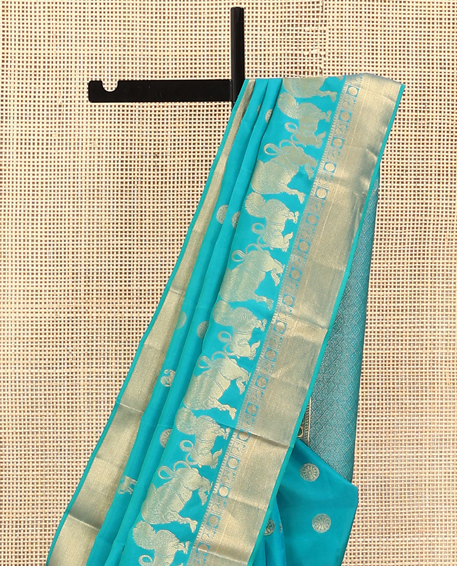 Blue Vasundhara Lite Silk Mix Saree, Gracefully Embellished with Yaali, Singam, and Chakram Buttas on Its Body, Highlighted by a Zari Border of Thilakam Mokku, Poun, Mayil, and Mayil Kann Designs, Subtle Jaal Pallu, and Paired with a Matching Blouse
