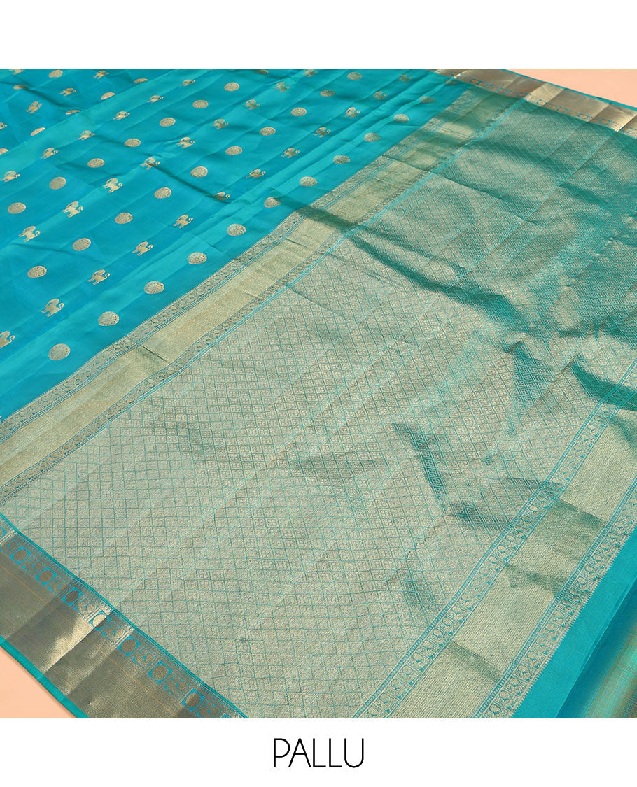 Blue Vasundhara Lite Silk Mix Saree, Gracefully Embellished with Yaali, Singam, and Chakram Buttas on Its Body, Highlighted by a Zari Border of Thilakam Mokku, Poun, Mayil, and Mayil Kann Designs, Subtle Jaal Pallu, and Paired with a Matching Blouse