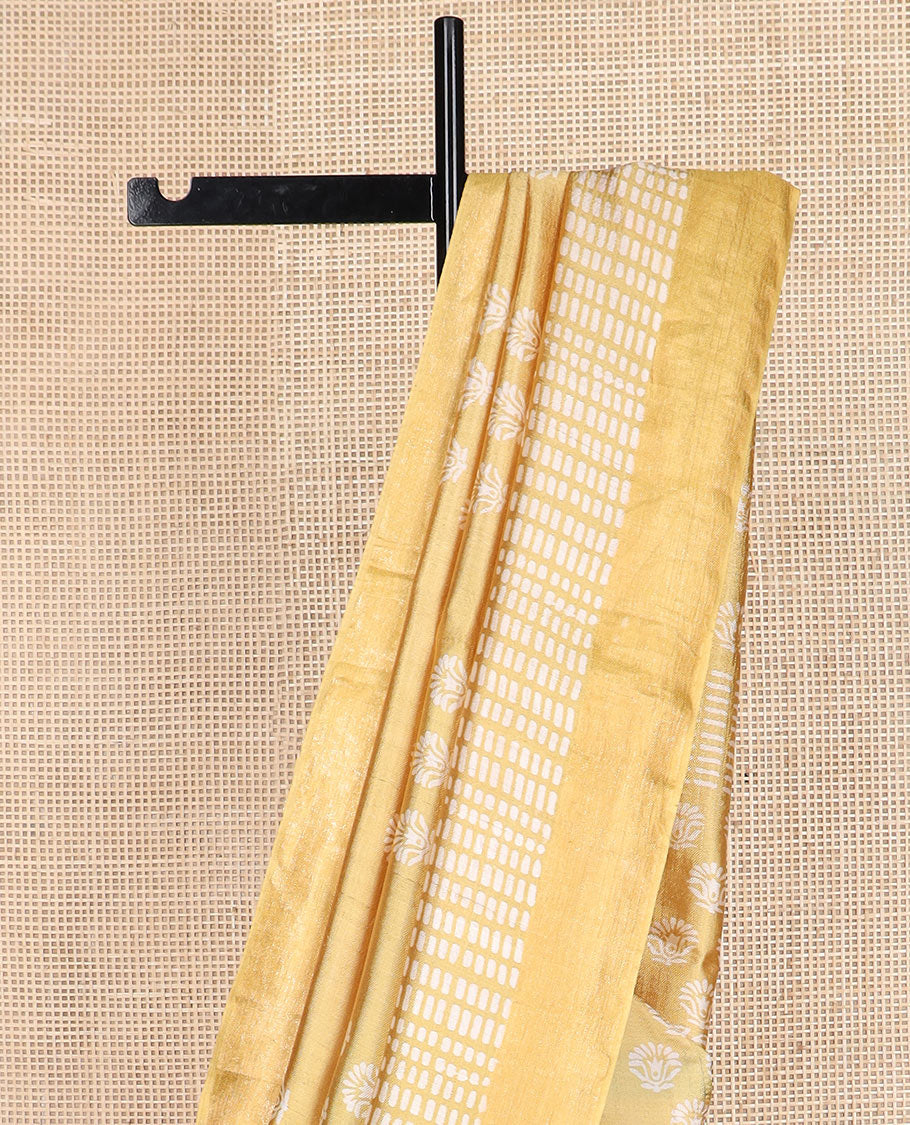 Yellow floral and geometric printed banana pith saree, zari border, and printed pallu
