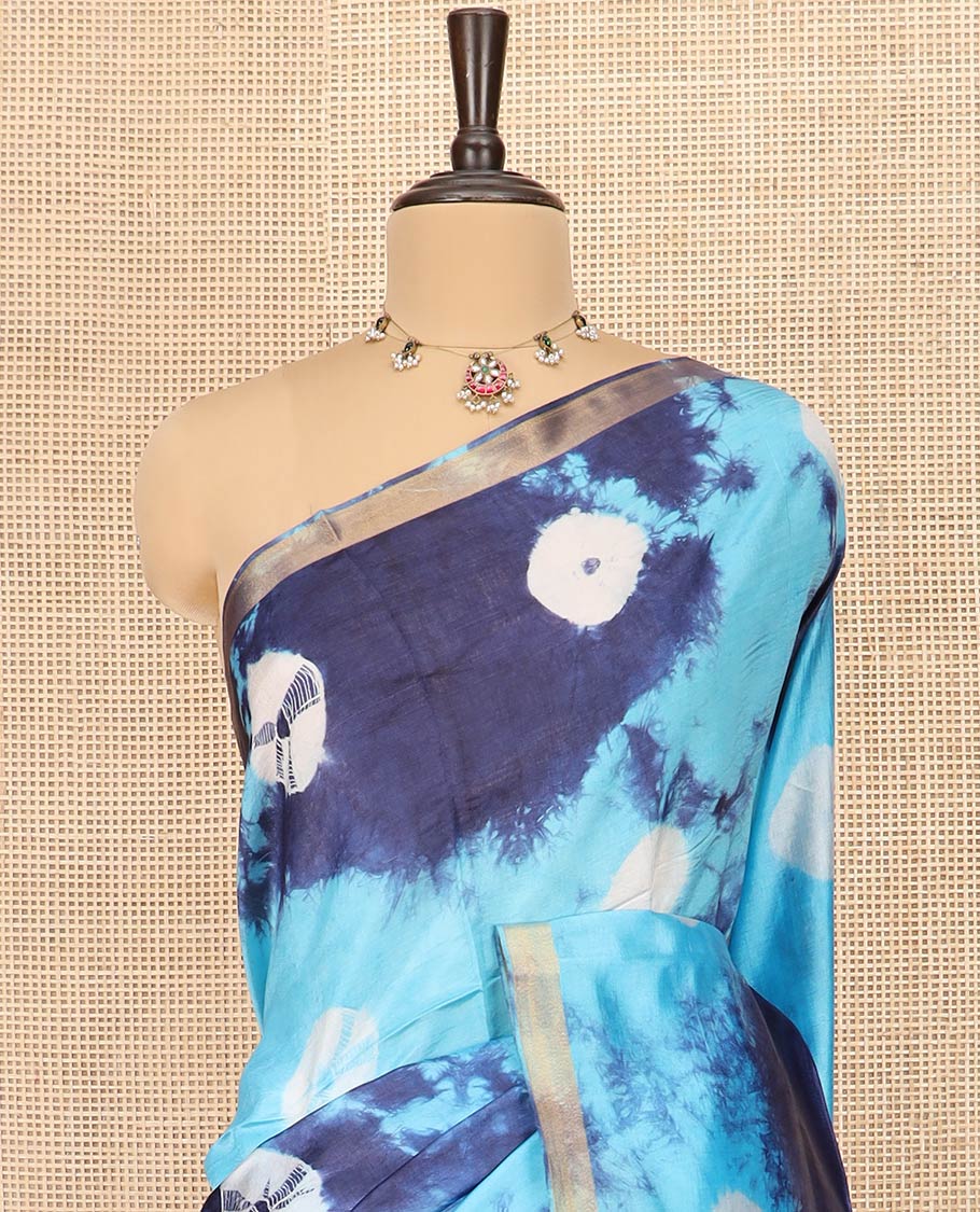 Blue Banana Pith Saree Enthralled with Shibori Prints, Zari Bavanji Border, Complemented with a Shibori Printed Pallu, and Paired with a Matching Shibori Printed Blouse