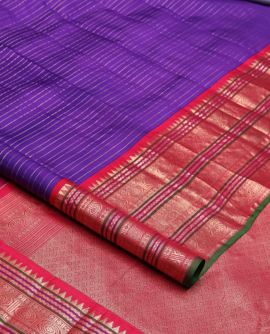 Blue zari stripes silk saree, contrast korvai border of rekku, neli, kamalam, and poo chakram designs, and jaal pallu
