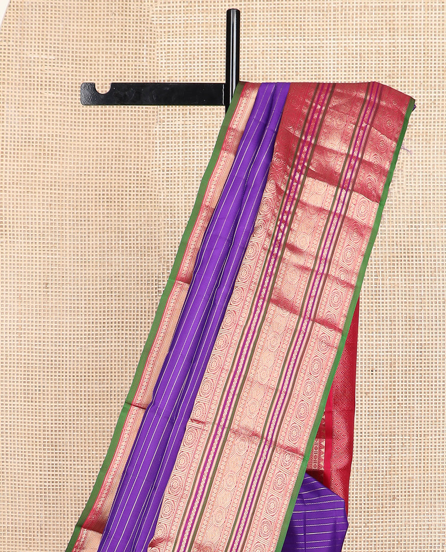 Blue zari stripes silk saree, contrast korvai border of rekku, neli, kamalam, and poo chakram designs, and jaal pallu