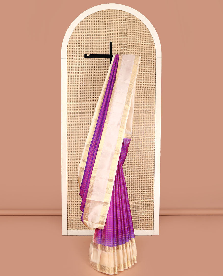 Purple Vasundhara Silk Saree, Steeped in Richness of Micro-Zari Checks All Over Its Body, Complemented by Contrast Rettai Pettu Border of Thilakam Mokku, Diamond, and Cross Kamalam Designs, Grand Jaal Pallu, and Paired with a Contrast Blouse