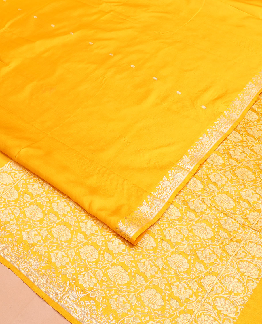 Yellow buttas woven banarasi kathan silk saree, zari border, and floral jaal pallu