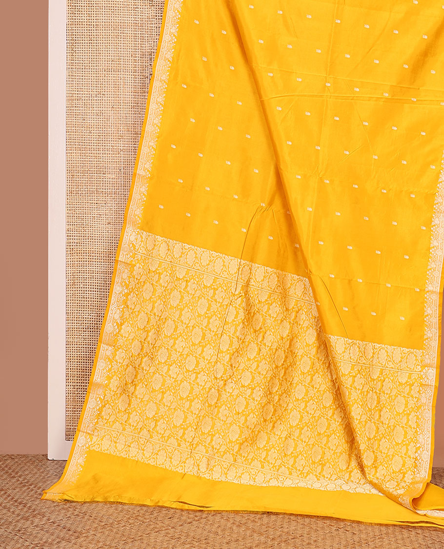 Yellow buttas woven banarasi kathan silk saree, zari border, and floral jaal pallu