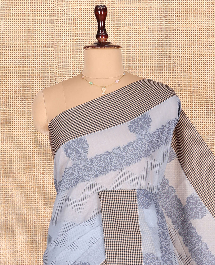 Grey Semi-Silk Cotton Saree, Ornamented with Chevron Stripes All Over Its Body, Complemented by Contrast Micro-Checked Border, Pallu of Jaal Designs, and paired with a Matching Blouse