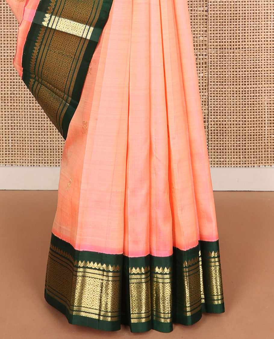 Pink zari buttas Kanchipuram silk saree, contrast one-sided korvai border of salangai, banaras, and jaal designs, and zari design pallu