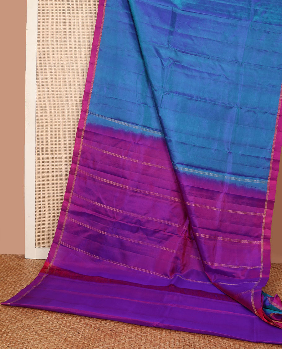 Blue plain design Kanchipuram silk saree, contrast zari striped border & zari striped pallu