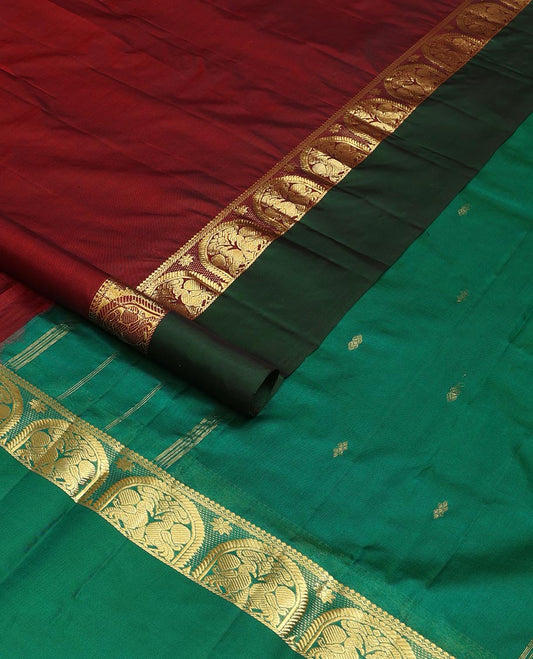 Maroon zari buttas Kanchipuram silk saree, contrast border of thilakam mokku, and mayil designs, and zari design pallu