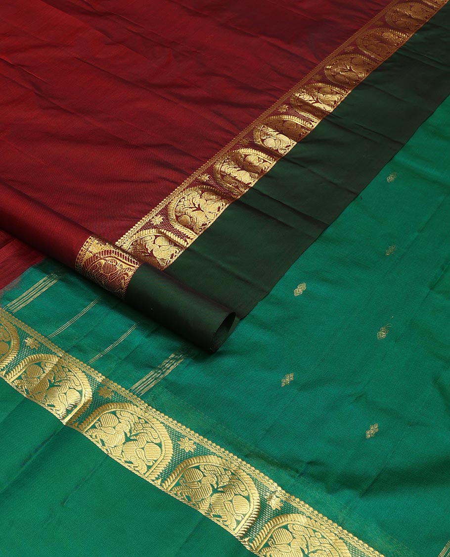 Maroon zari buttas Kanchipuram silk saree, contrast border of thilakam mokku, and mayil designs, and zari design pallu