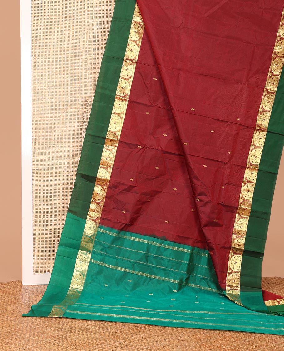 Maroon zari buttas Kanchipuram silk saree, contrast border of thilakam mokku, and mayil designs, and zari design pallu